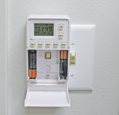 Shabbos Smart Switch timer mounted over a toggle light switch on a wall plate
